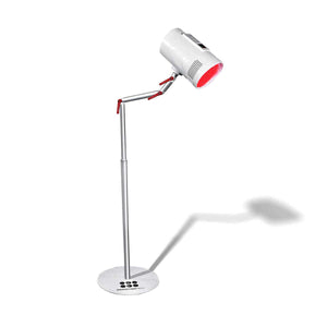 A targeting red light therapy device mounted on a floor stand, with a pivoting and rotating head.