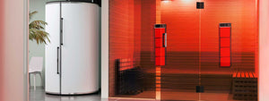Wellness center with a glass front sauna featuring red light therapy panels on the wall.