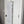 Load image into Gallery viewer, Red light therapy device on a interior door.