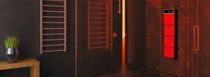 Waterproof red light therapy panel in a all black shower.