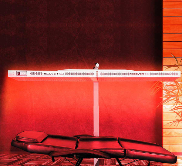 Glowing room with red light therapy device.
