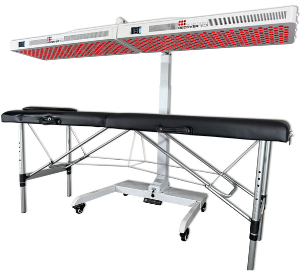 Massage table with red light therapy panels above.
