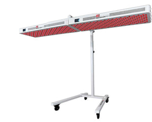 Two red light therapy lights on a stand for over a red light therapy mat.