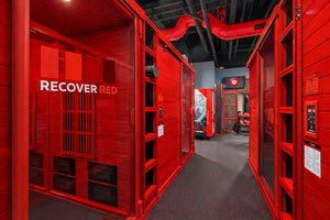 Commercial cedar rooms down a hallway with Recover Red branding.