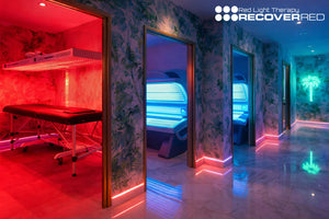 Tanning salon with new Red light therapy room distinctively glowing red.