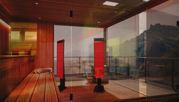 Looking into a modern commercial sauna overlooking the mountains featuring two red light therapy devices.