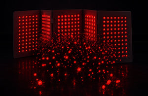 Travel Red LED panel with a starry effect on a black background.